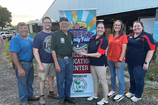 University of Illinois Extension staff presenting the 2025 Community Partner Award to Jersey County Fair Association; (left to right) Phil Ringhausen, Connor Ashlock, Tom Moore, Jessica Jaffry, Beth Steckel, and Sara Marten.