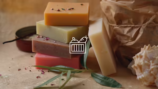 A stack of cut homemade soap on a butcher block.