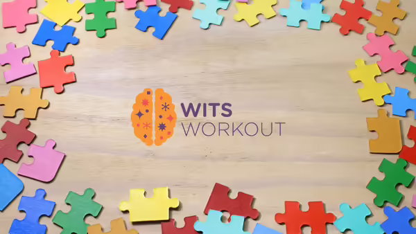 An orange brain surrounded by colorful puzzle pieces.