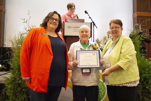Karen Glynn receives the Sustained Excellence Award at the fiftieth Master Gardener Conference.
