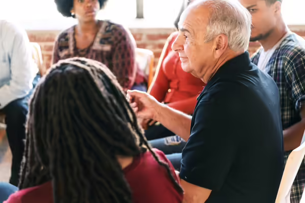 Group of people meeting in a circle