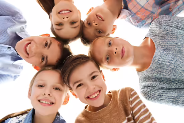 Smiling kids in a circle
