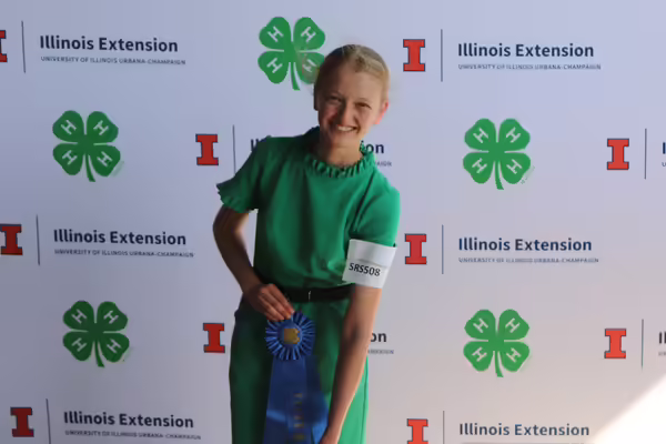 Maddy Canada poses with blue ribbon.