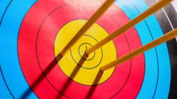 Archery target with arrows stuck in it