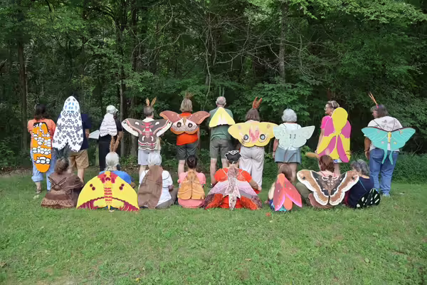 people wearing homemade moth wings