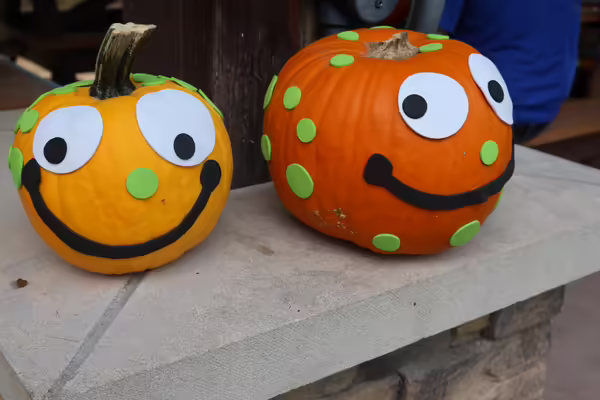 yellow and orange pumpkins with smiley faces