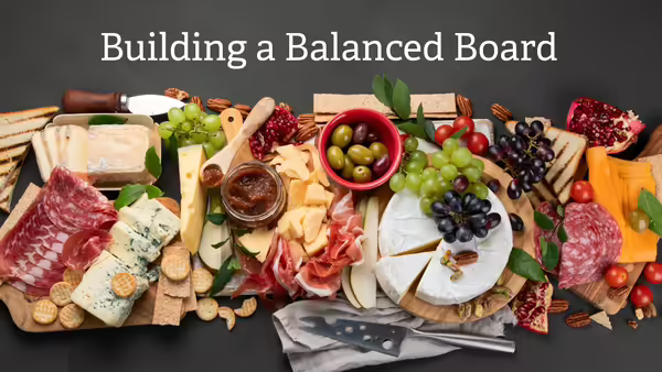 a healthy charcuterie board with meats, cheeses, and fruits