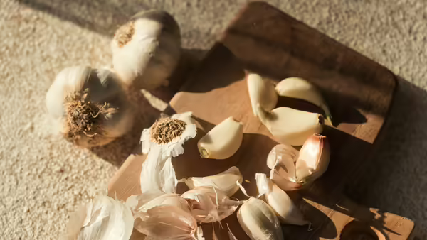 garlic bulb on a cutting board