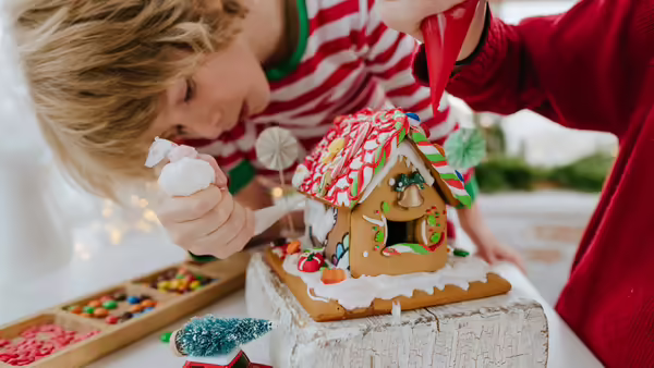 Boy making a gingerbread house