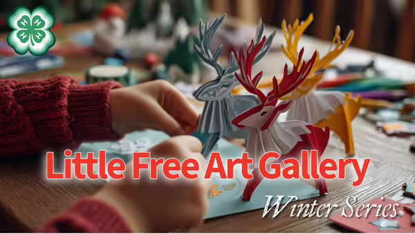 Youth making paper deer decorations