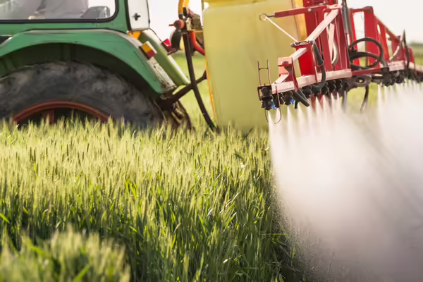 close-up of a tractor spraying a field