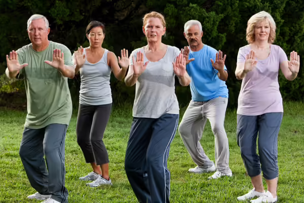 Group of older adults practicing tai chi