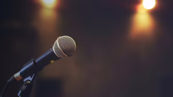 Close up of microphone on stage lighting 