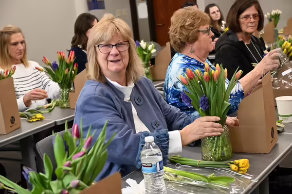 a lady arranging tulips
