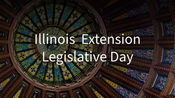 "Illinois Extension Legislative Day" in front of the Illinois capitol dome interior