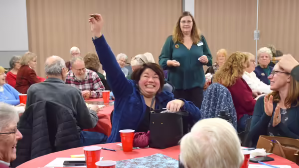 Sarah Smith raising her hand