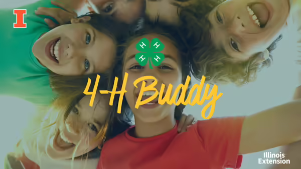 A group of kids standing in a circle with their heads touching looking at the same object from above.