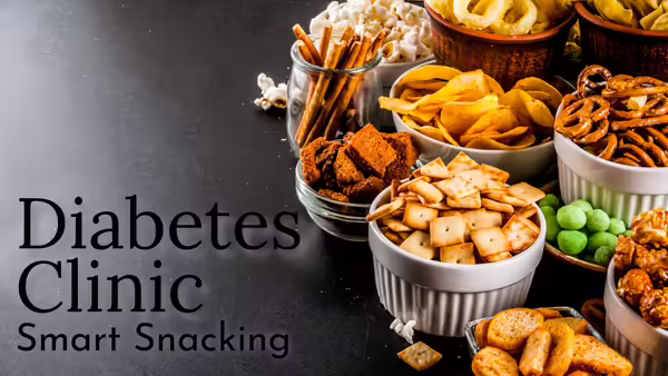 A gray table with bowls of snacks on the right side.