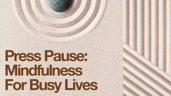 Sand garden that has text that says "Press Pause: Mindfulness for Busy Lives"