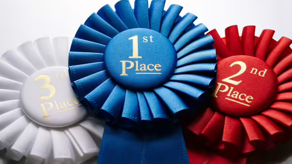 white third, blue first and red second place ribbons