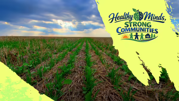 Rows of crops with the words "Healthy Minds, Strong Communities"