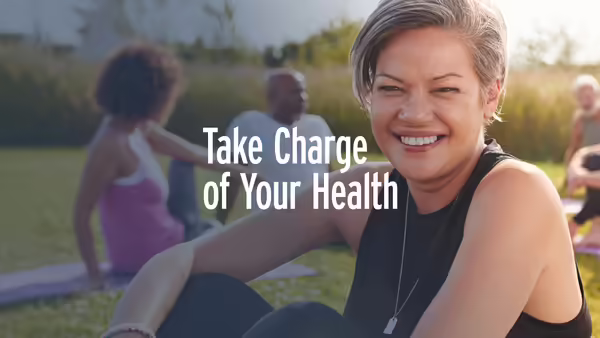 A woman smiling and exercising outdoors.