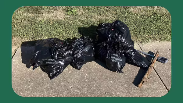 A pile of filled black trash bags.