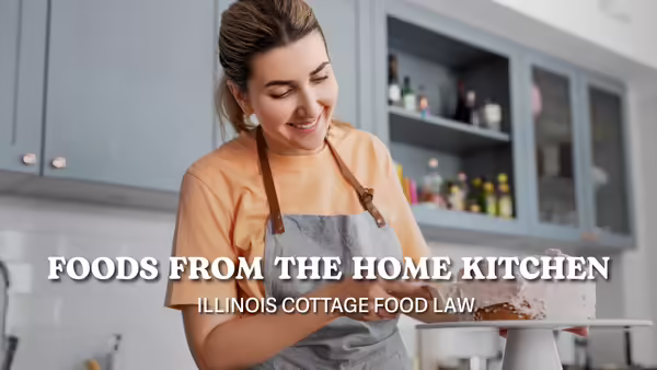 woman in kitchen wearing an apron