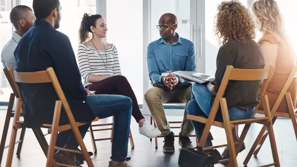 A group of diverse people talking 