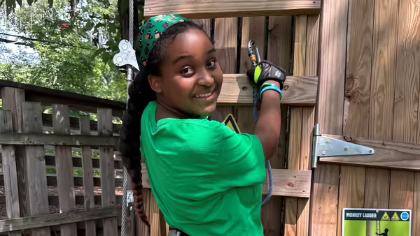 Summer camper enjoying Go Ape Zipline and Adventure Park event