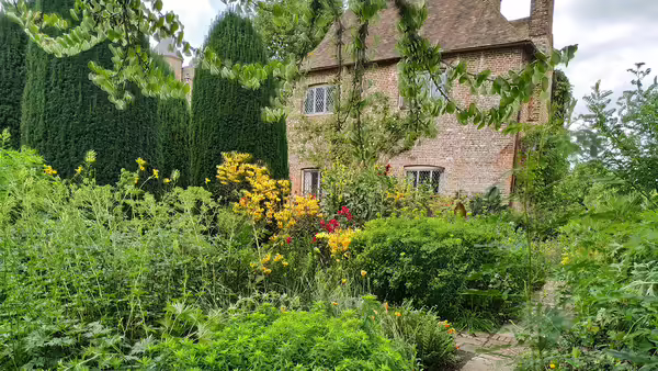 brick house with green garden