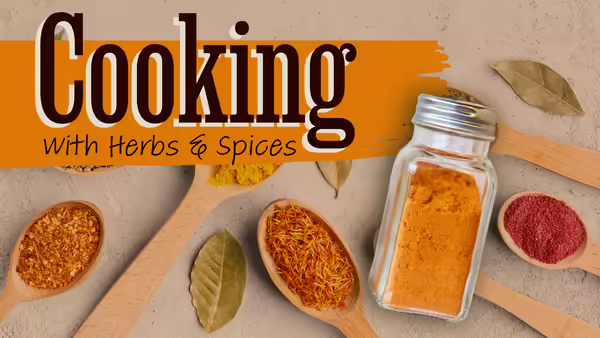 A table with spices on it that says "Cooking with herbs and spices"
