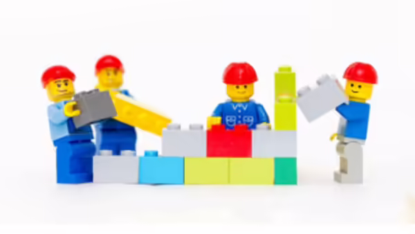 Lego people building bricks