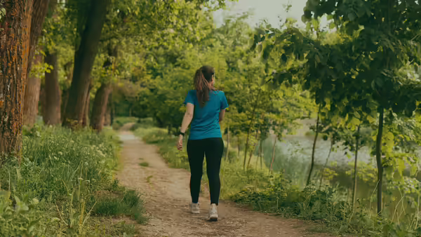 woman walking in forest