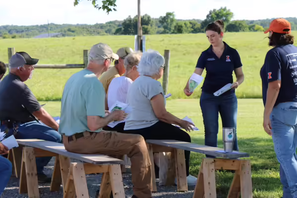 Bronwyn Aly and Kacie Athey speaking to a group of registrants at the Dixon Springs Agricultural Field Day