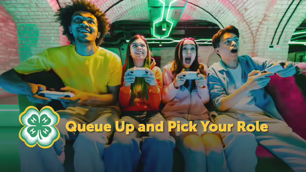 Queue Up and Pick Your Role yellow text overlaying a picture of a group of four youth with controllers playing games