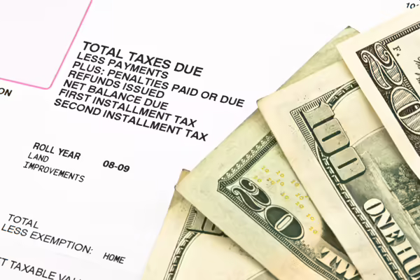 Property taxes and money displayed.