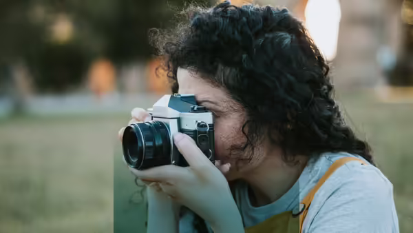 person taking picture with camera