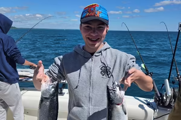 4-H member holding two fish