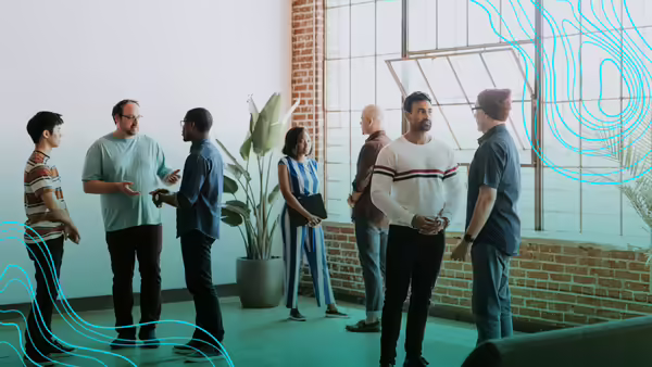 group of people standing around talking