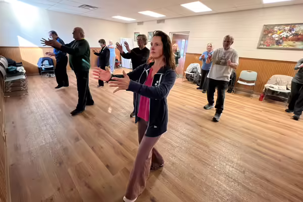 Food and Nutrition Educator Kristin Bogdonas leading a class of tai chi for older adults 