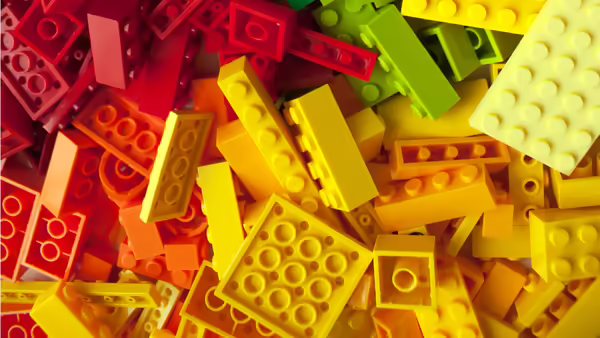 pile of red, orange, and yellow building bricks