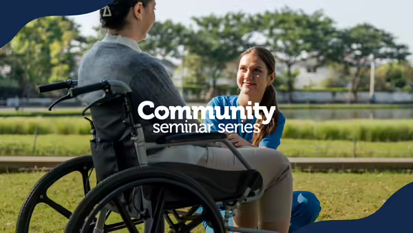 A person in a wheelchair talking to another person