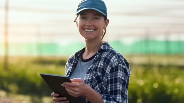 smiling gardener with tablet