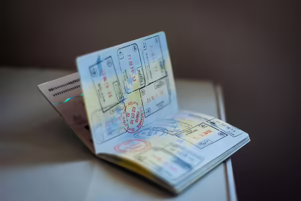 open passport book with stamsp