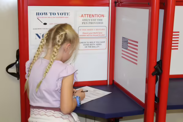 Ava Smith, member of the Villa Grove Grover Clovers, fills out her voting ballot. 