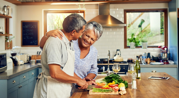 Two people cooking healthy in a kitchen