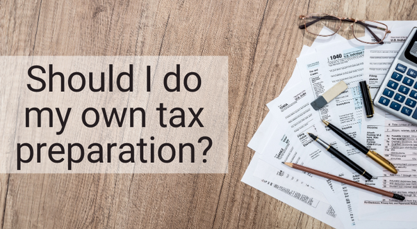 Should I do my own tax preparation? title with tax documents and calculator