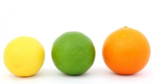 Picture of a lemon, lime, and orange on white background