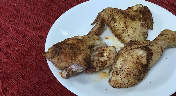 Cooked chicken wing, leg, and thigh
